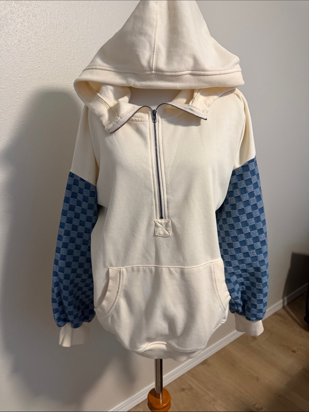 Cozy Cream Half-Zip Hoodie with Blue Checkered Sleeves